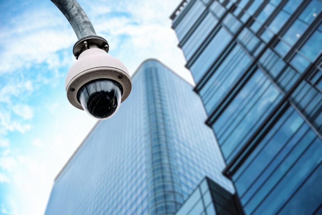 security camera with glass building background